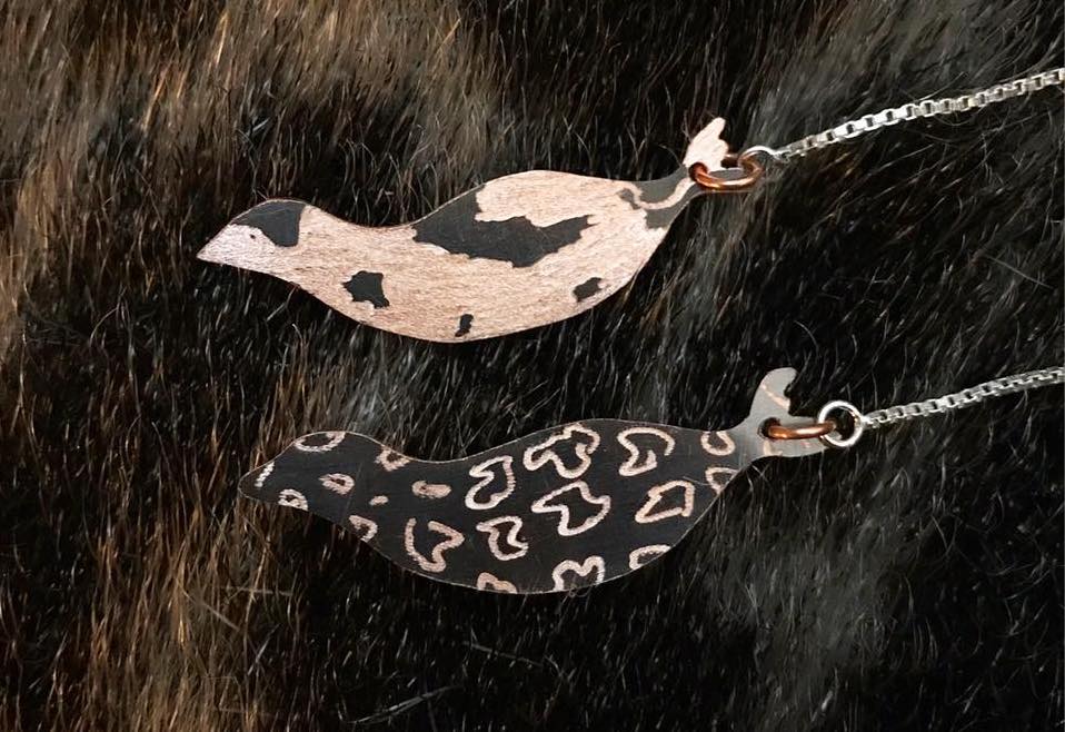 Double sided earrings qairulik and natchiq on copper with sterling silver ear threads