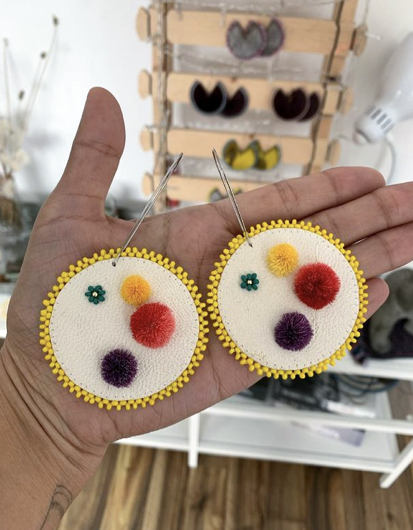 Scraped sealskin with caribou tufting beaded earrings (2021)