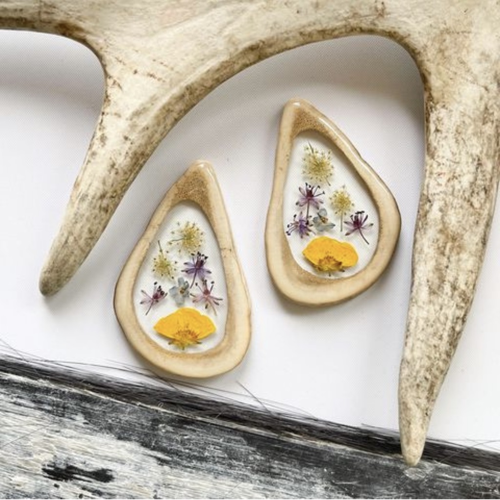 Mixed wild flowers in caribou antler