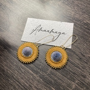 Moosehide earrings (2023) caribou hair, moosehide, Charlotte cuts and 24k gold beads