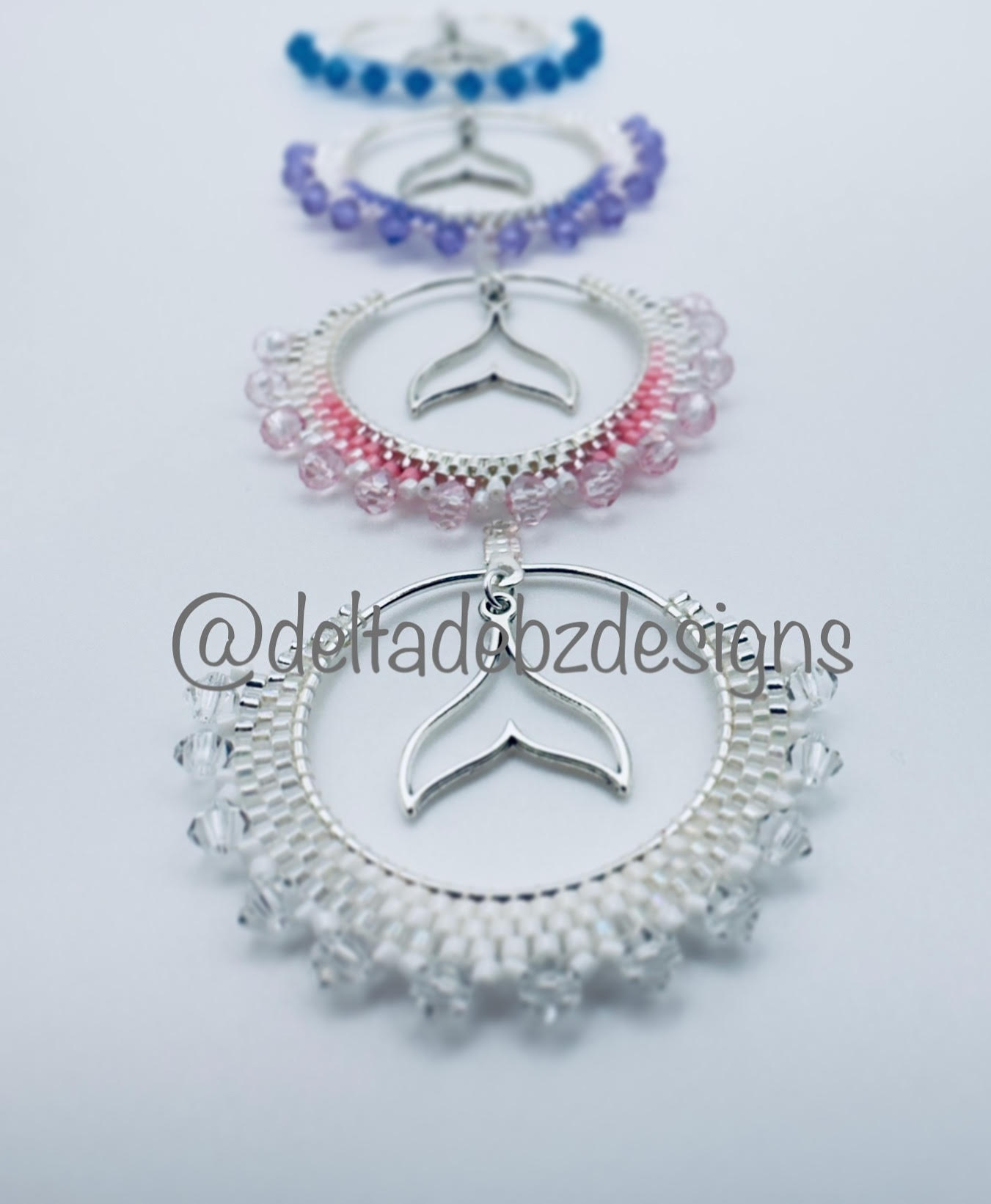 Untitled (Beaded hoops with whale tale charms) (2023)