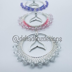 Untitled (Beaded hoops with whale tale charms) (2023)