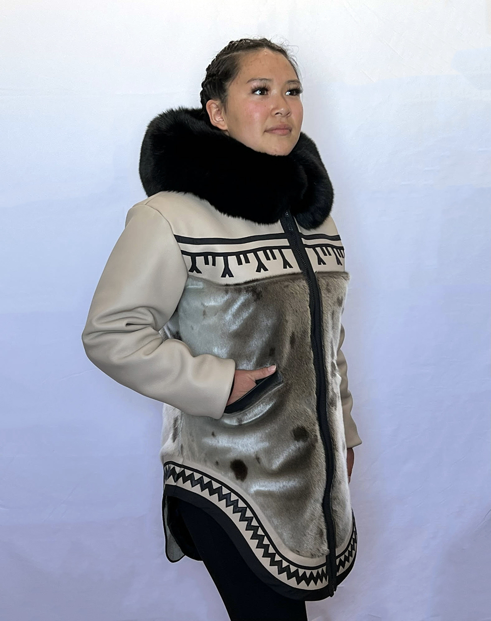 May and Elizabeth Ningeongan, Beige/black tunniit tattoo leather design parka (2022) With Elizabeth Ningeongan. Model Dawn Siutinuar