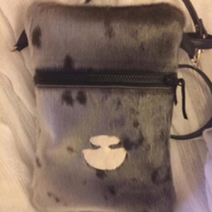 Untitled (Sealskin pouch with ulu)