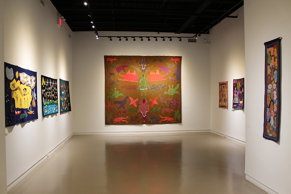 Installation view of Wall-Hangings by Gloria Inugaq Putumiraqtuq (2001)