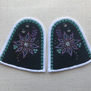 Qallinik with white and bias tape, black background and purple flower (2020)