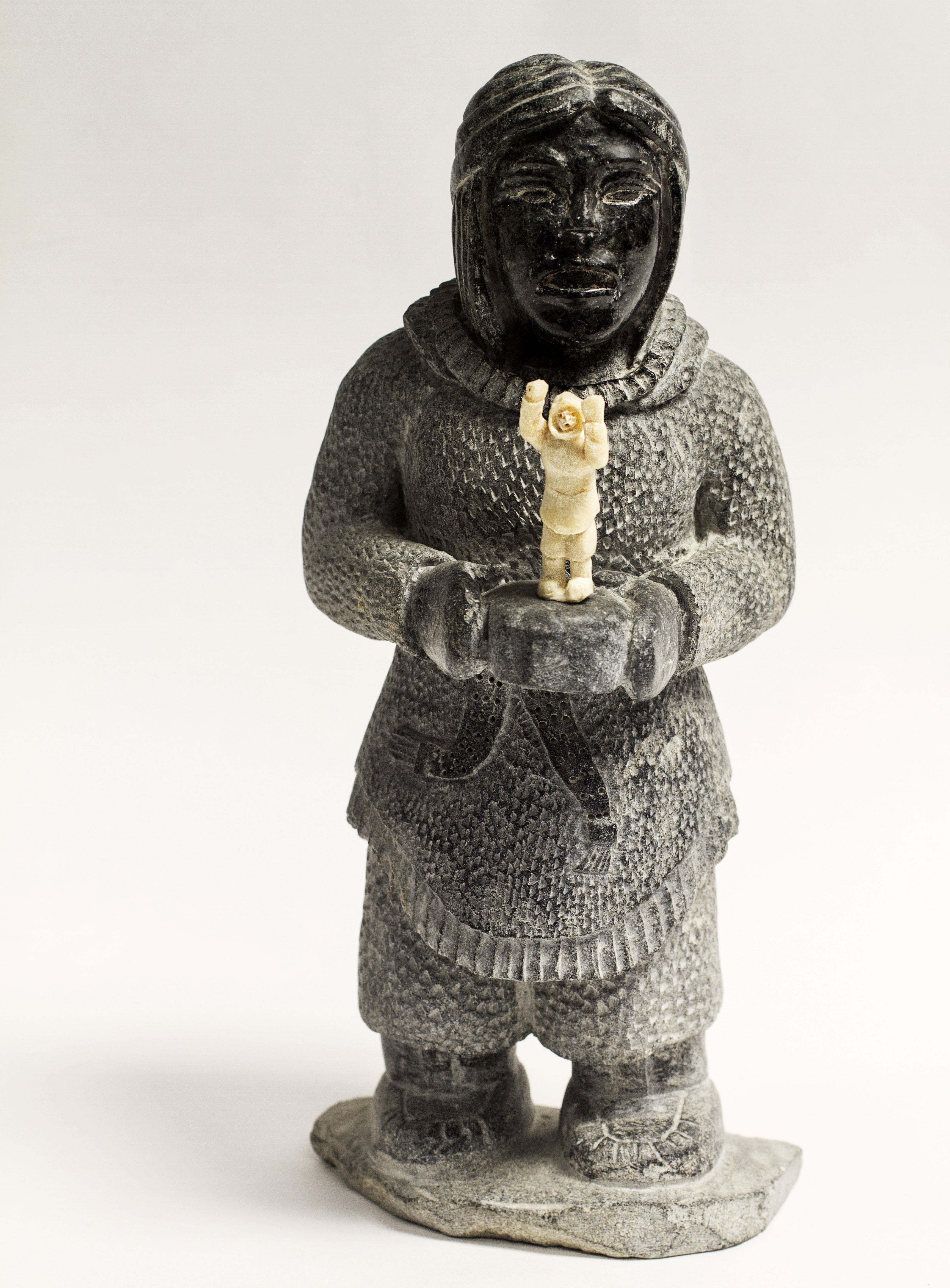 NatakokNoahWomanWithCarving