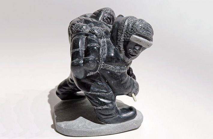 IllitisukTiviFatherCarryingTiredSonOnTheLand