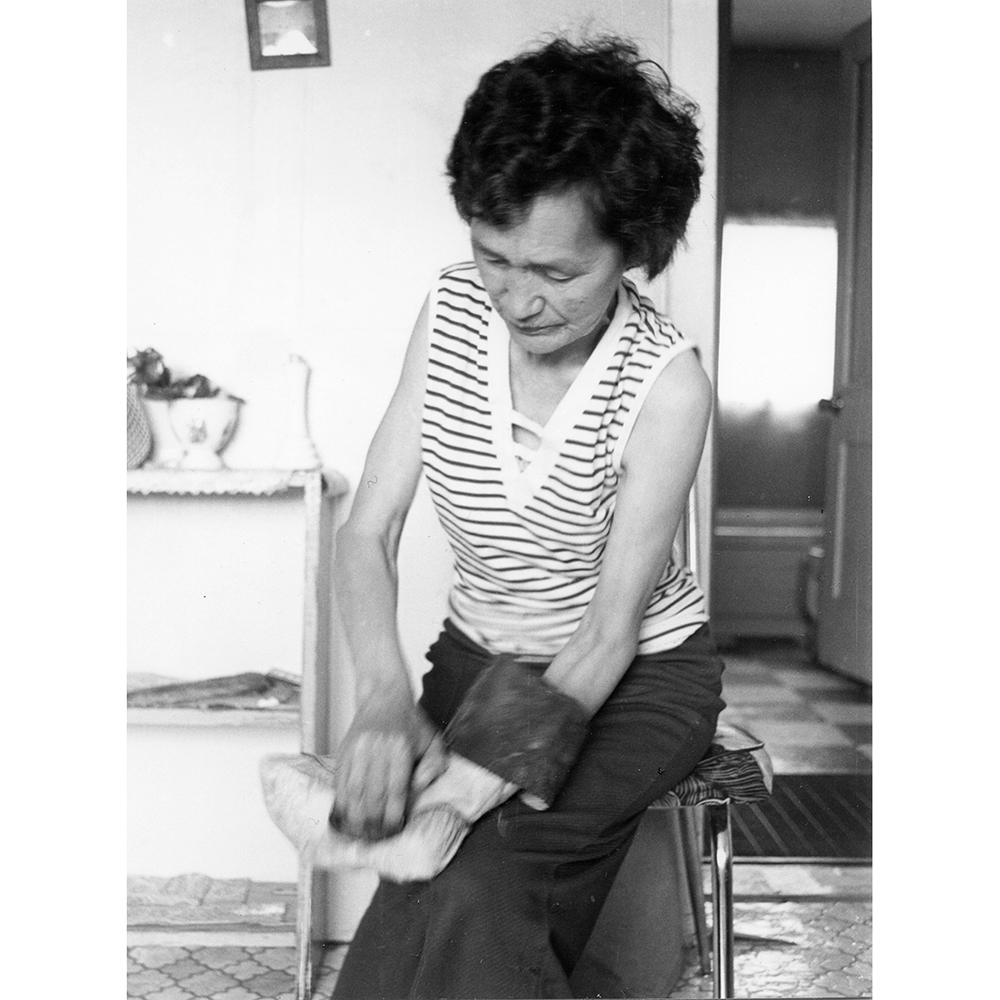 35.2_Feature_ThemDays_Susannah-Igloliorte-using-a-scraper.-Happy-Valley,-1977.-Val-Hearder-photo